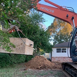 Using a backhoe to install a new Septic Tank